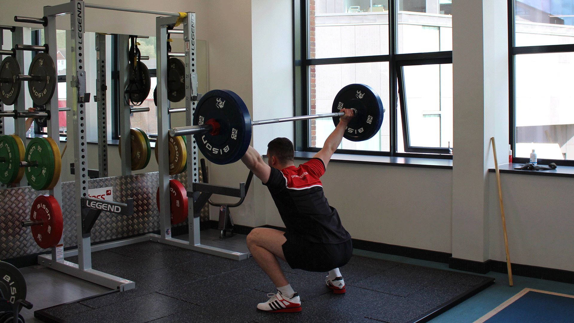 Student lifting weights at Human Performance Lab