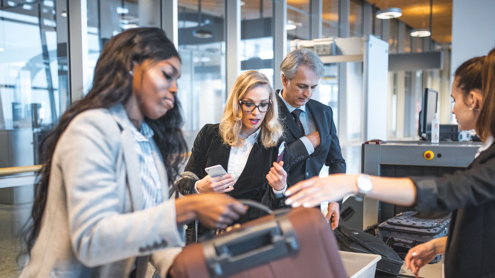 Group of people at airport security 
