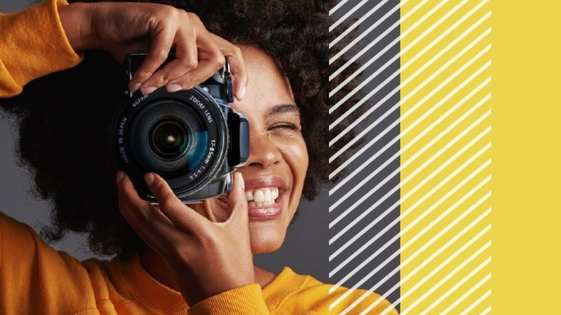 Female taking a picture with a DSLR camera