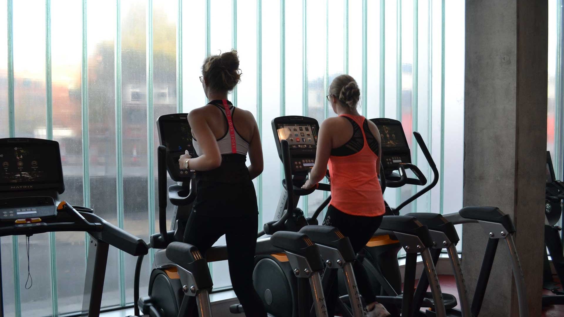 Two ladies on running machines