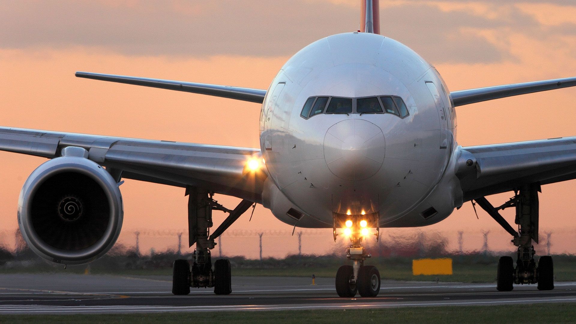 front view of an airplane on a runway
