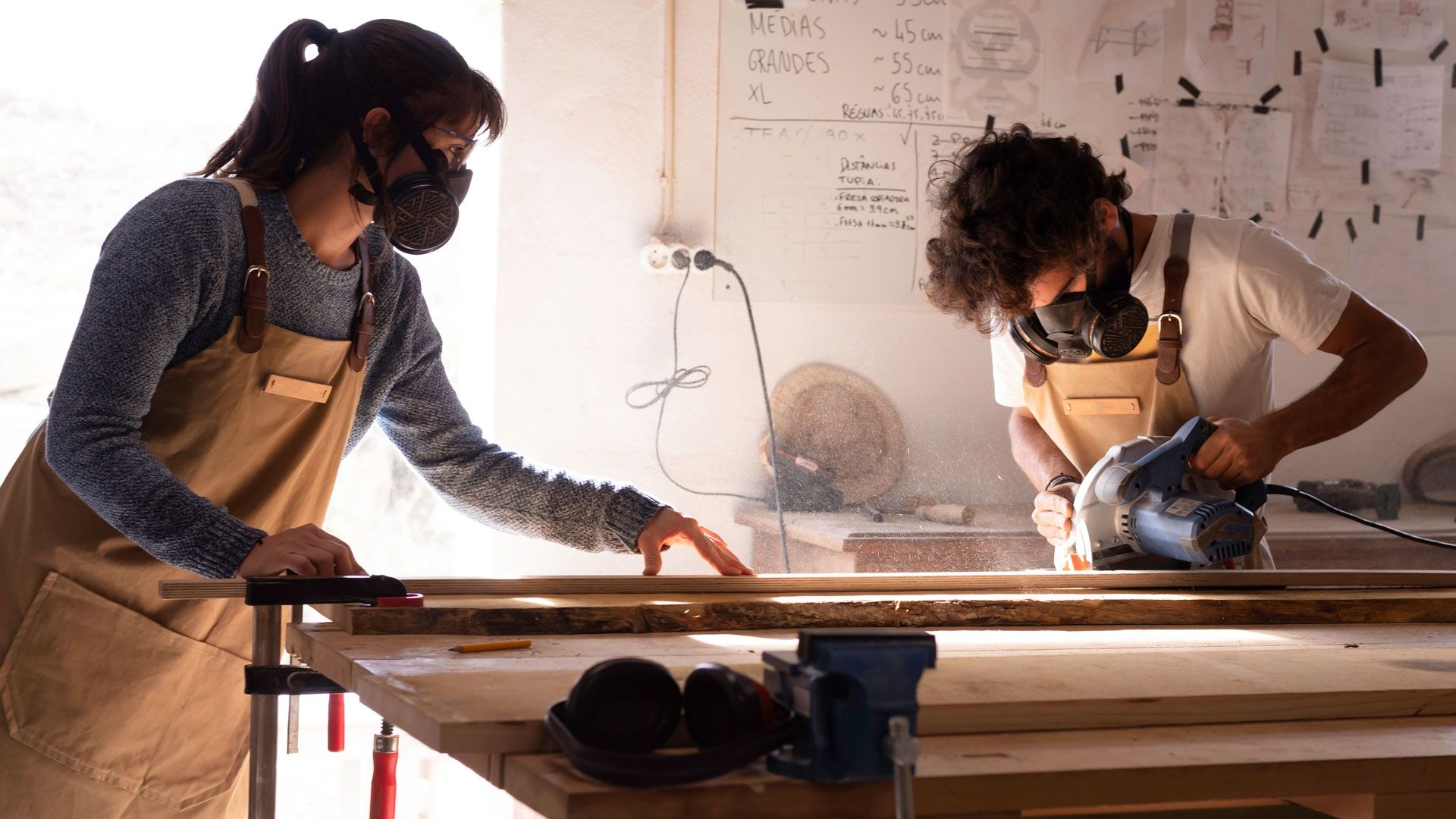 Two students (one female one male) using product design workshop 