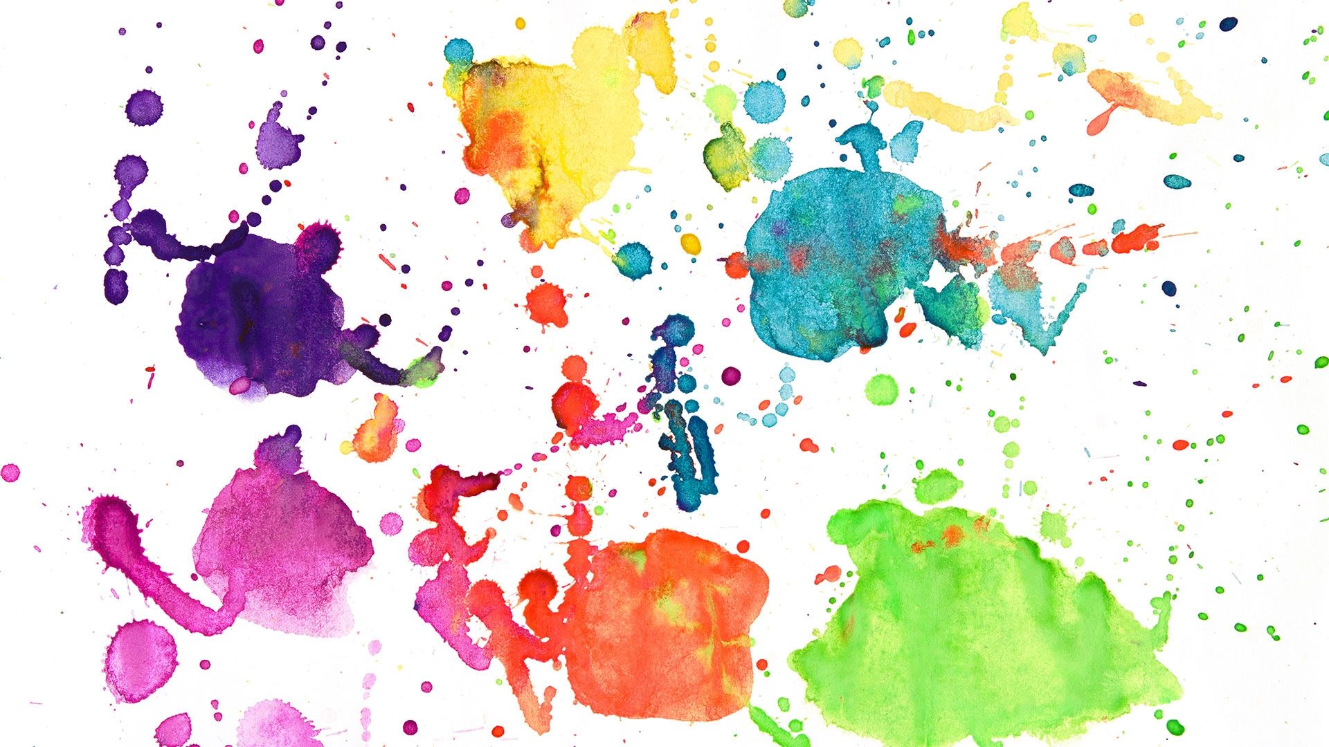 Paint splatters in an array of colours on a white background