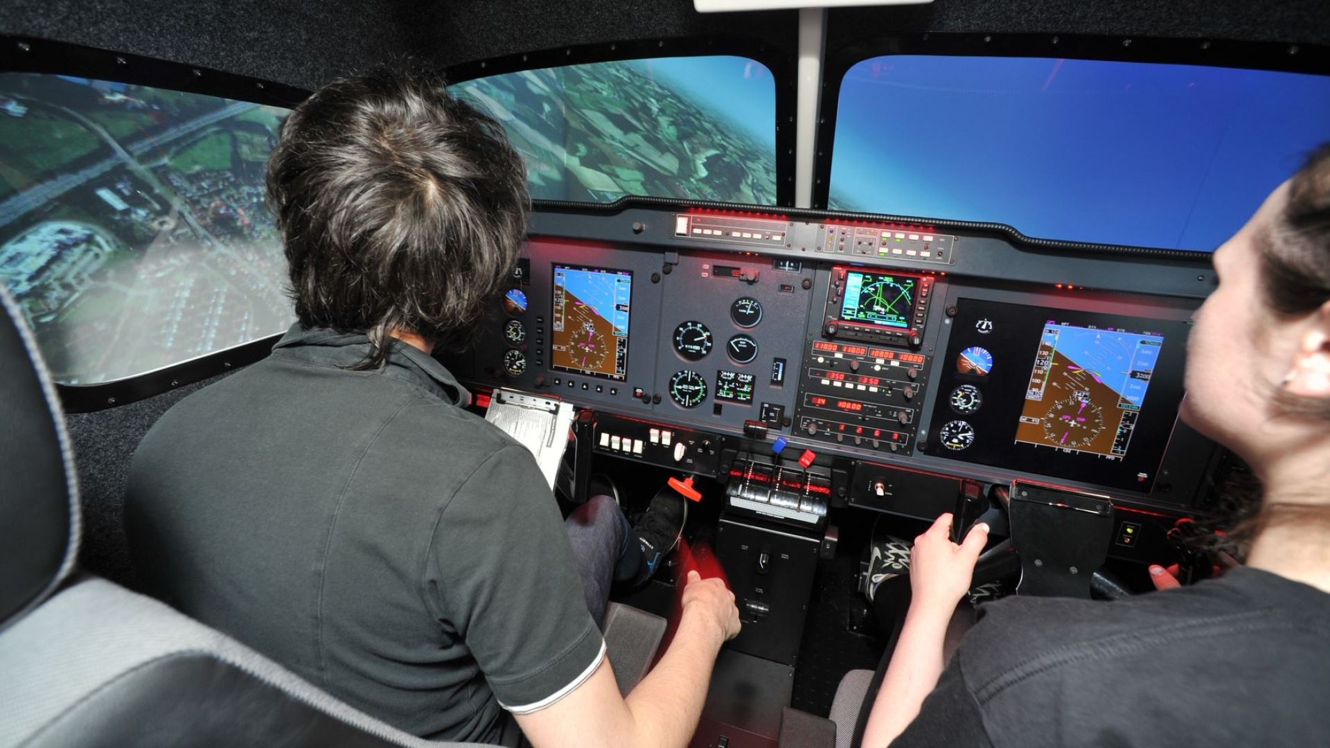 students in aviation simluator