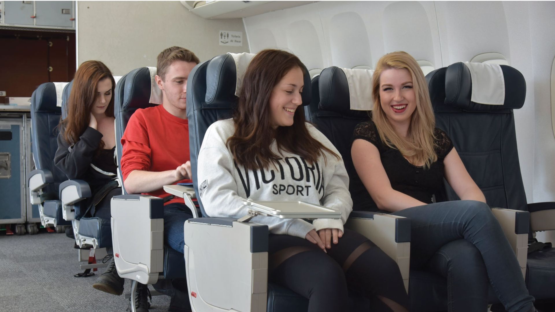 aviation students sat together in a simulation plane
