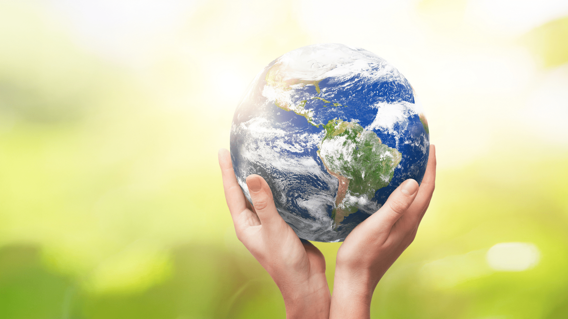 Image of hands holding up the world