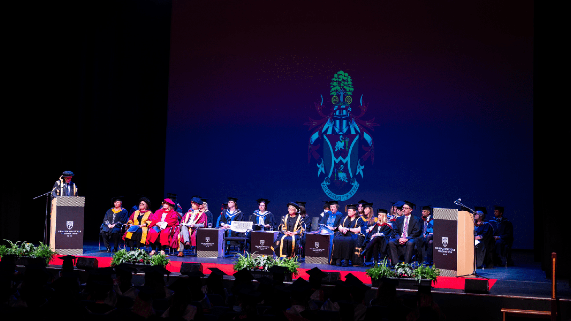 Graduation guests sat in the awards ceremony whilst the Vice-Chancellor gives a speech