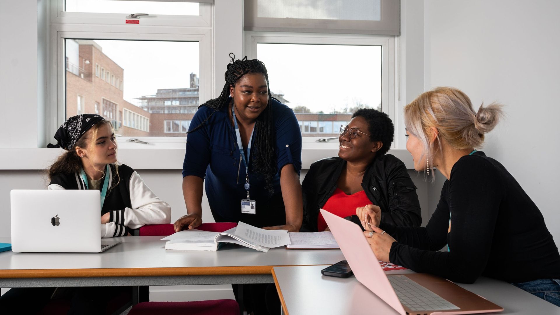Lecturer talking to students in classroom