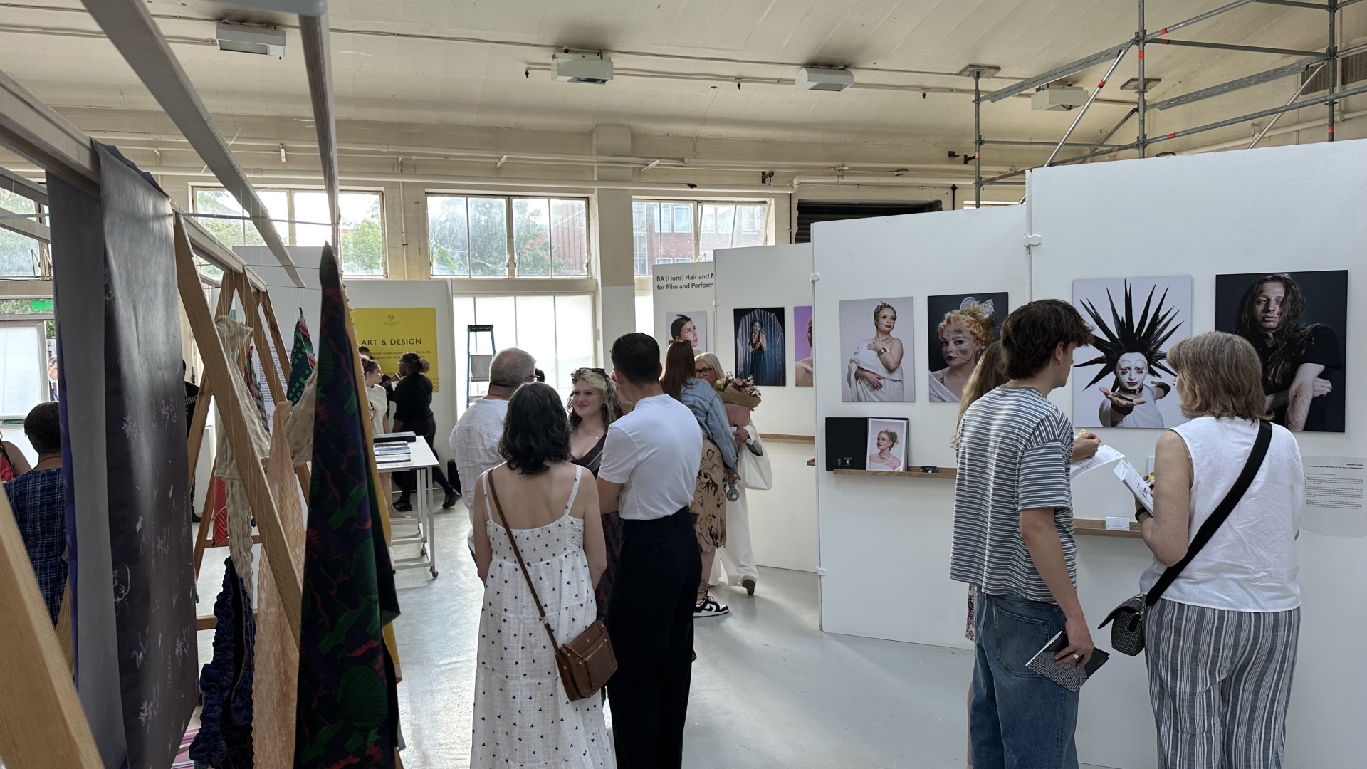 Guests attend the opening of the Art & Design Summer show