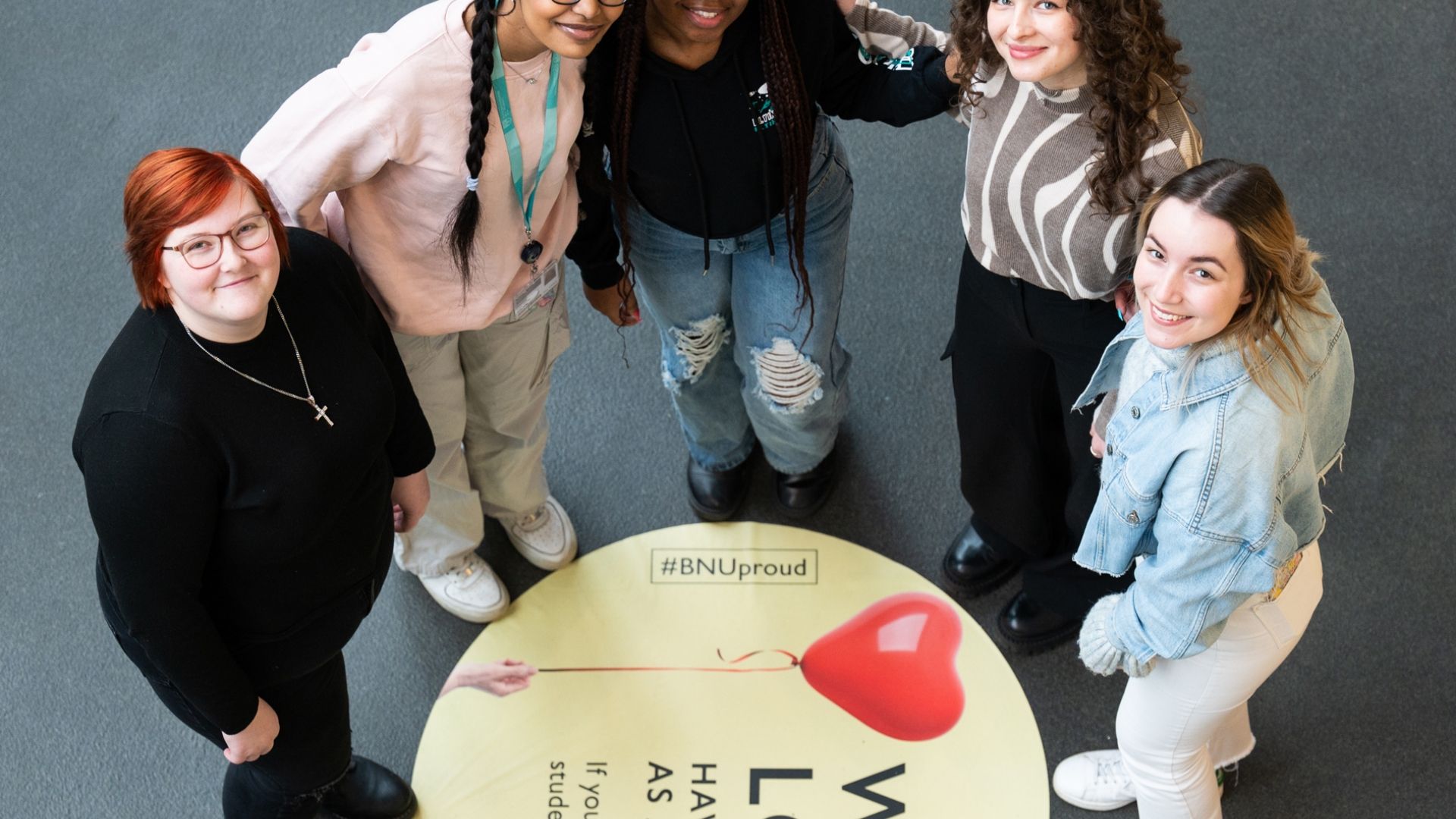 Group of BNU students in gateway by love sign