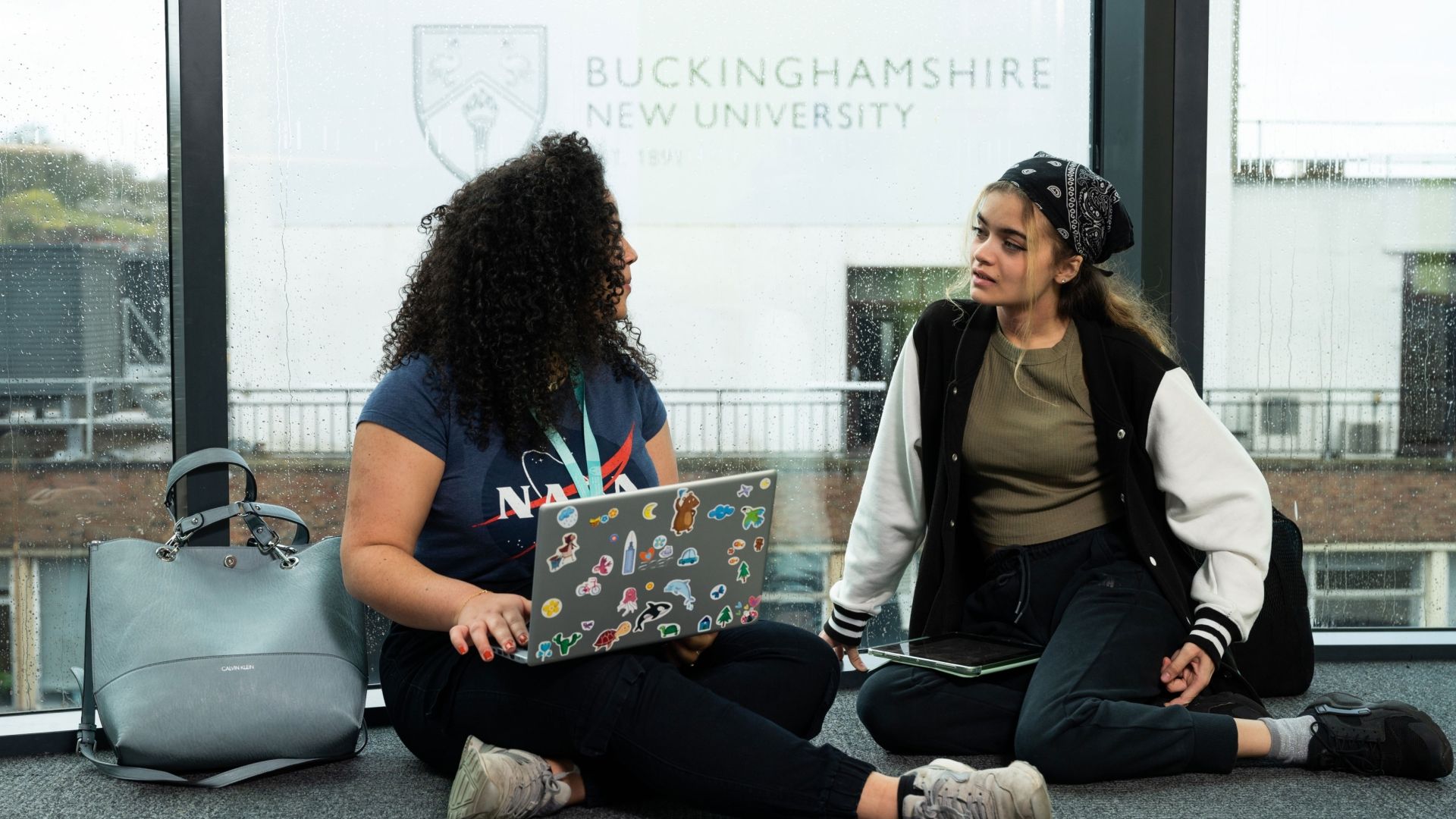 Students with laptops in High Wycombe campus