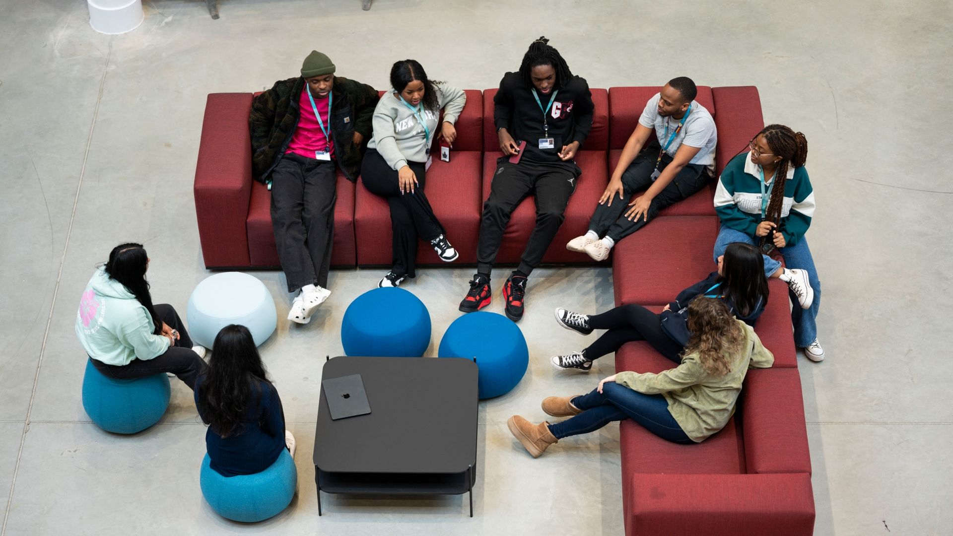Group of students chatting in the Atrium