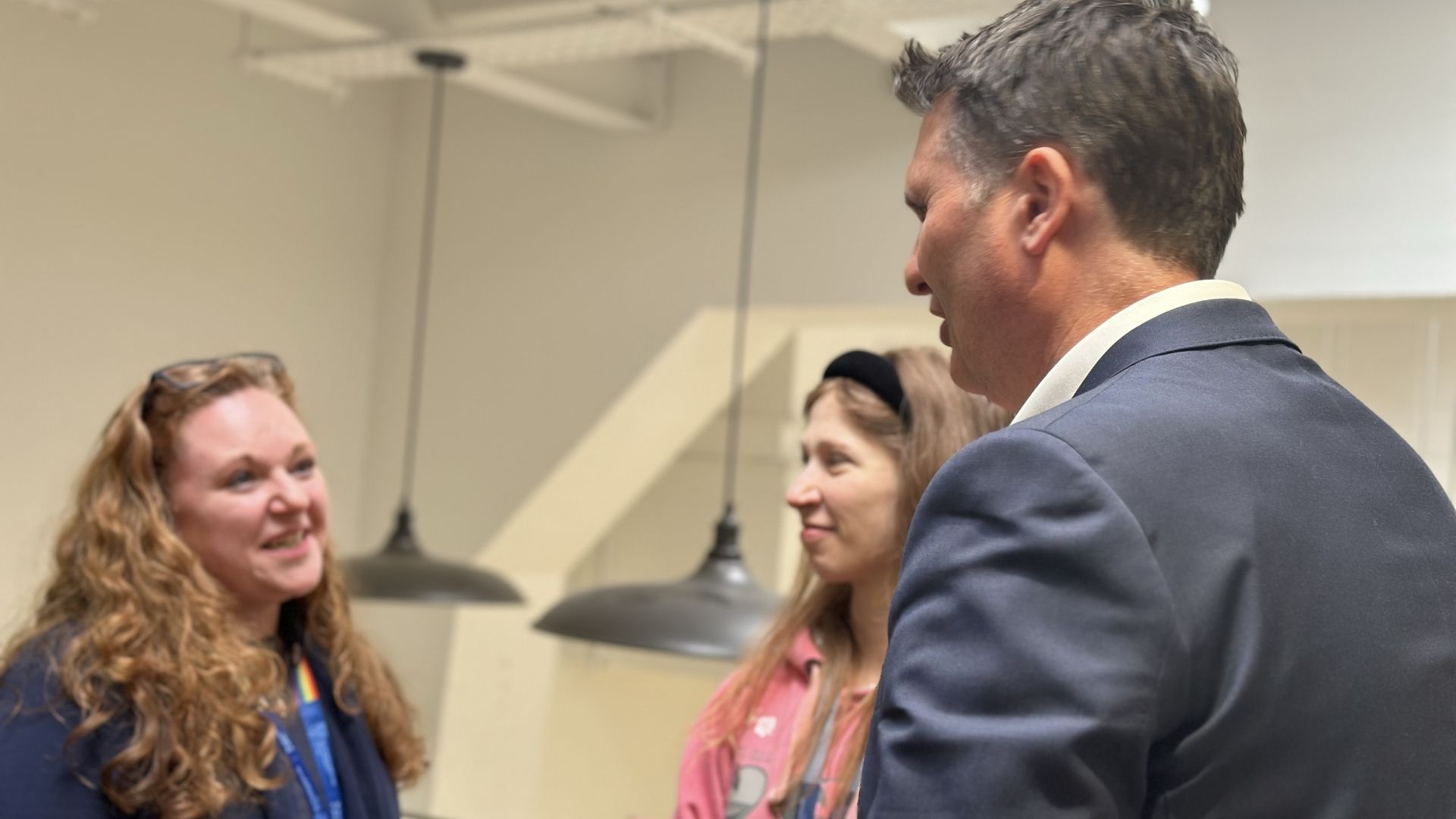 Professor Paul Morgan talks to colleagues at drinks reception