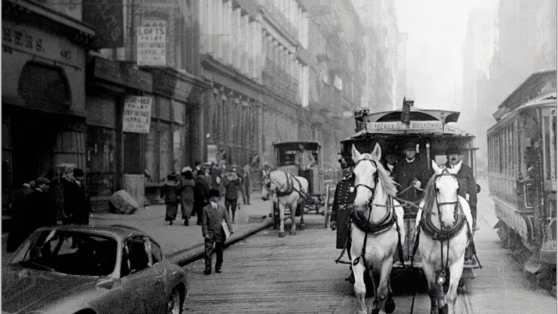 Early 1900s photo with horses and carriages on a main street