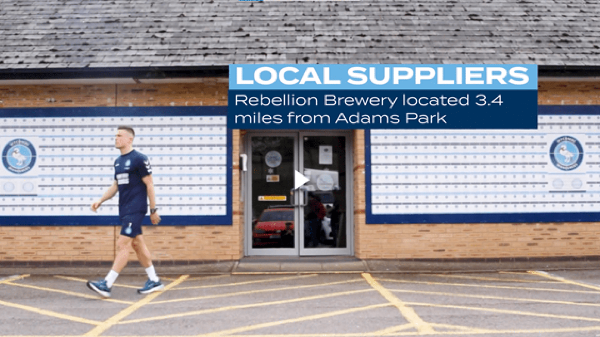 Still from Wycombe Wanderers student film shows David Wheeler walking out of Adams Park stadium