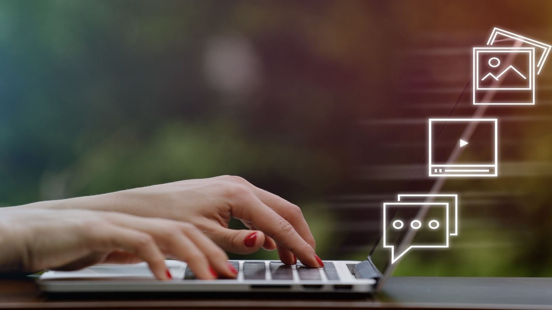 hands using a laptop with speech bubbles coming out the screen