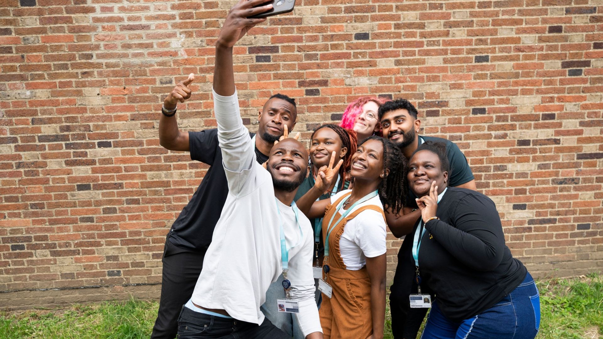 Group of students taking a selfie with a smartphone