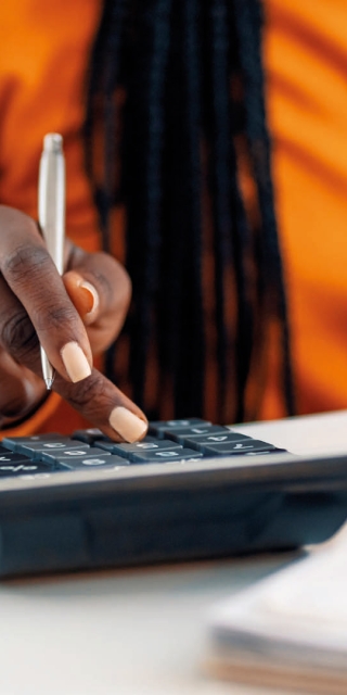 A close up of a calculator on a table student typing office