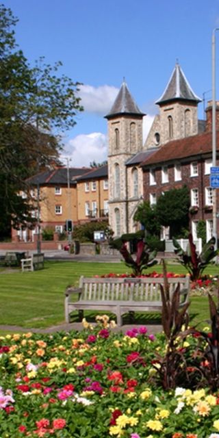 Benches and flower garden in front of town buildings in High Wycombe