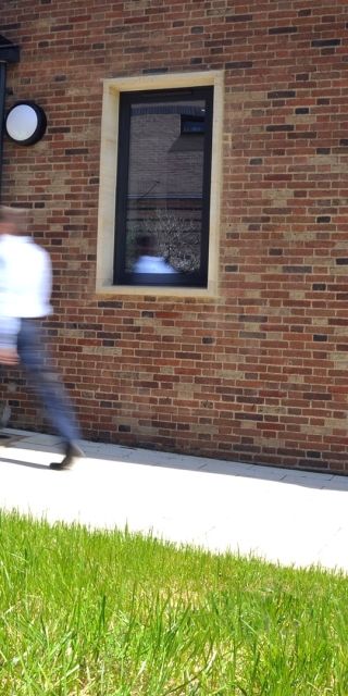 A photo of the Human Performance, Exercise and Wellbeing Centre sign on the outside of the building
