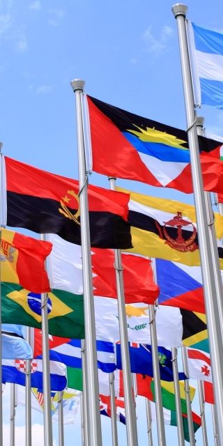 world wide country flags flying in the wind