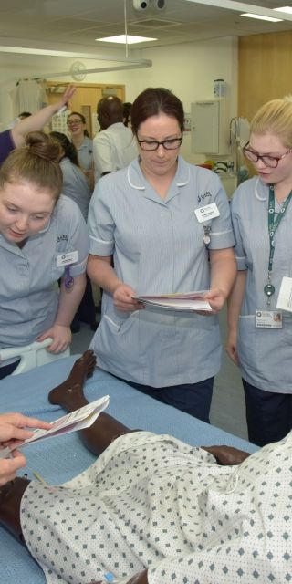 Group of Nursing students with mannequin 
