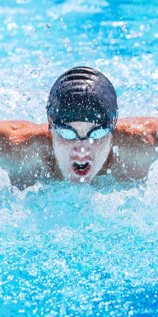 man swimming in a pool
