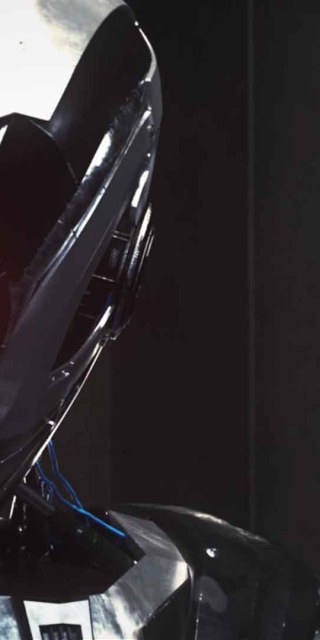 Animated robot like character against a dark background