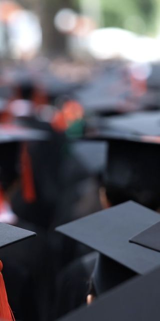 Back of heads of students wearing Graduation hats