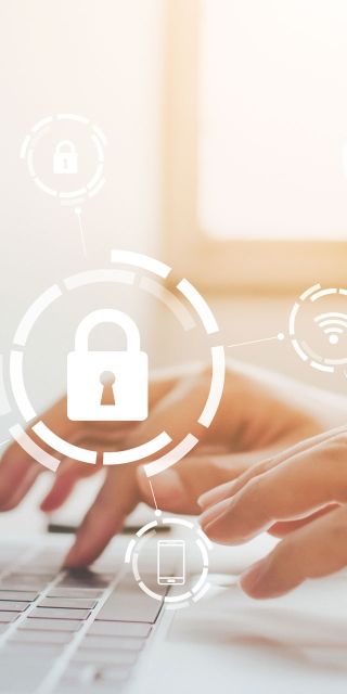 Cyber security person on laptop with lock symbol 