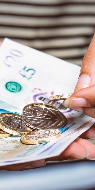 Student holding money