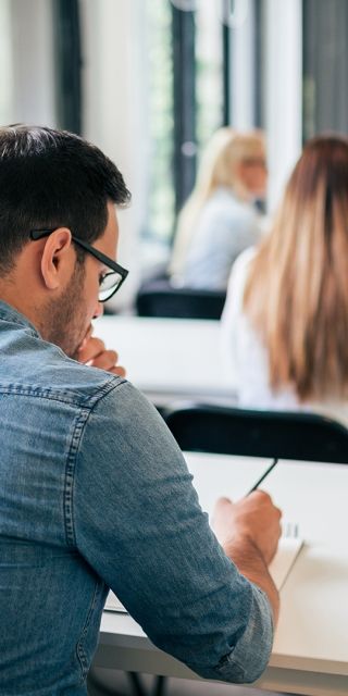 Student taking exam/working
