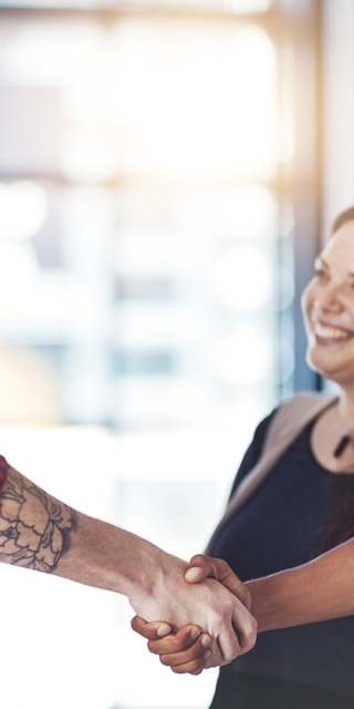 Adults shaking hands forming a partnership