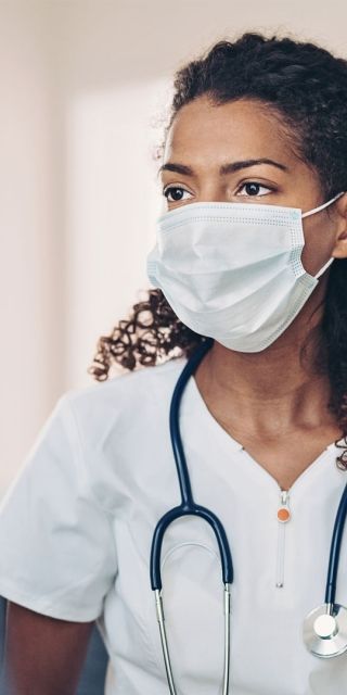 Female nurse consulting elderly patient