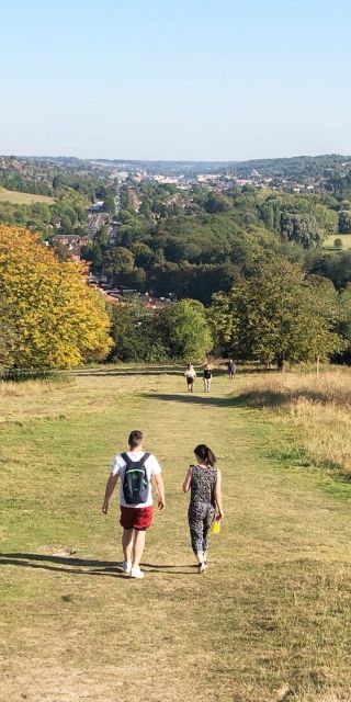 Male and female student walking in the English countryside