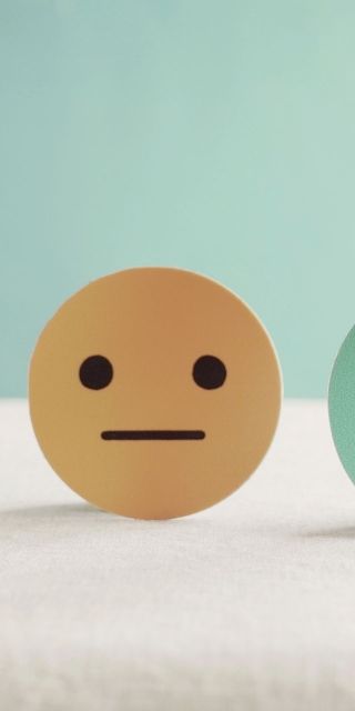 Three faces to show different emotion - mental health