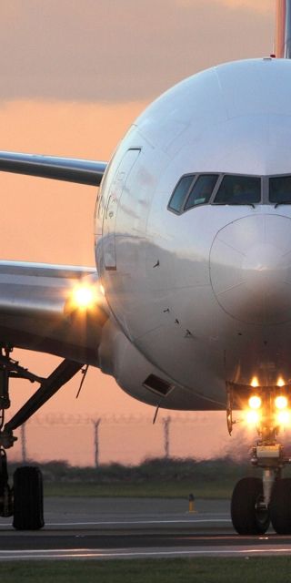 front view of an airplane on a runway