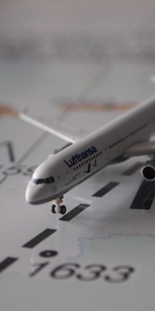 miniature plane on a map aviation