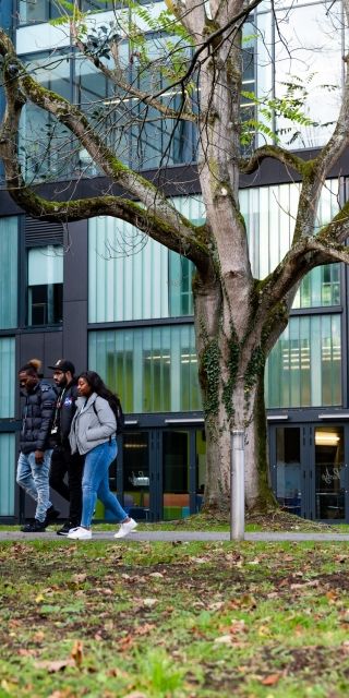 Group of three students walking outside High Wycombe campus
