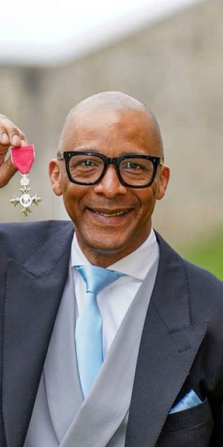 Picture of Jay Blades receiving his MBE