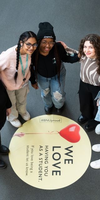 Group of BNU students in gateway by love sign
