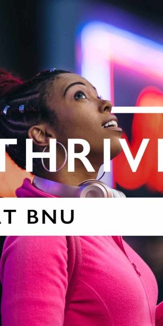 Thrive at BNU text over the top of a woman looking up from her phone.