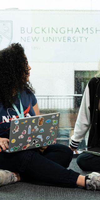 Students with laptops in High Wycombe campus