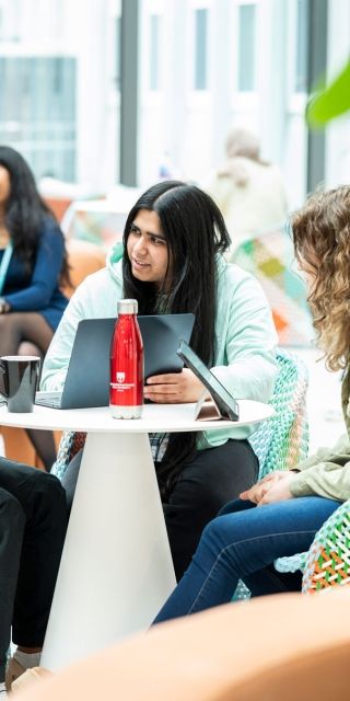 Group of students sat together in Winter Garden
