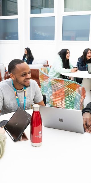 Group of students sat together in Winter Garden