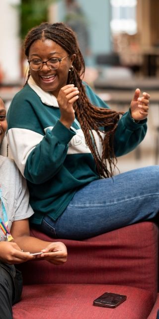 Group of students chatting in the Atrium