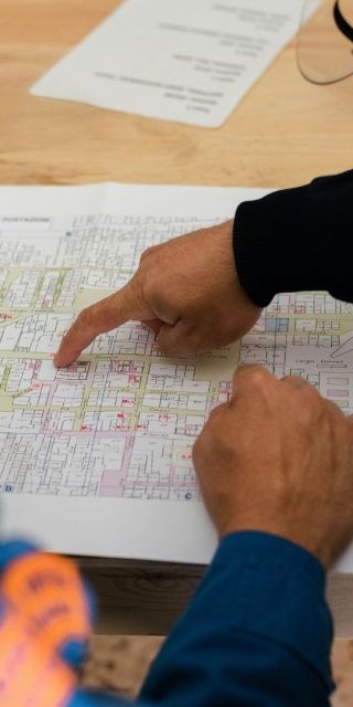 Two Engineering students looking at a site plan