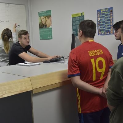 Man being handed in to a police station 