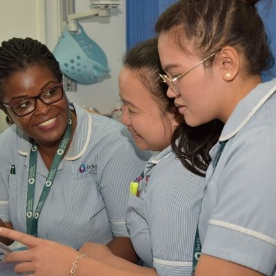 Three student nurses in uniform