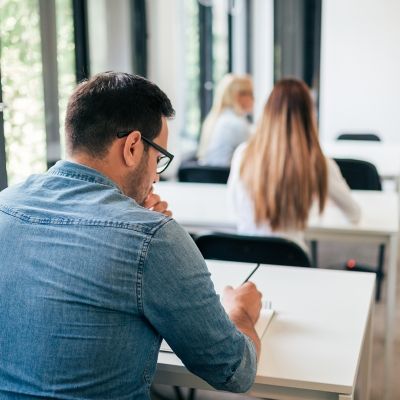 Student taking exam/working